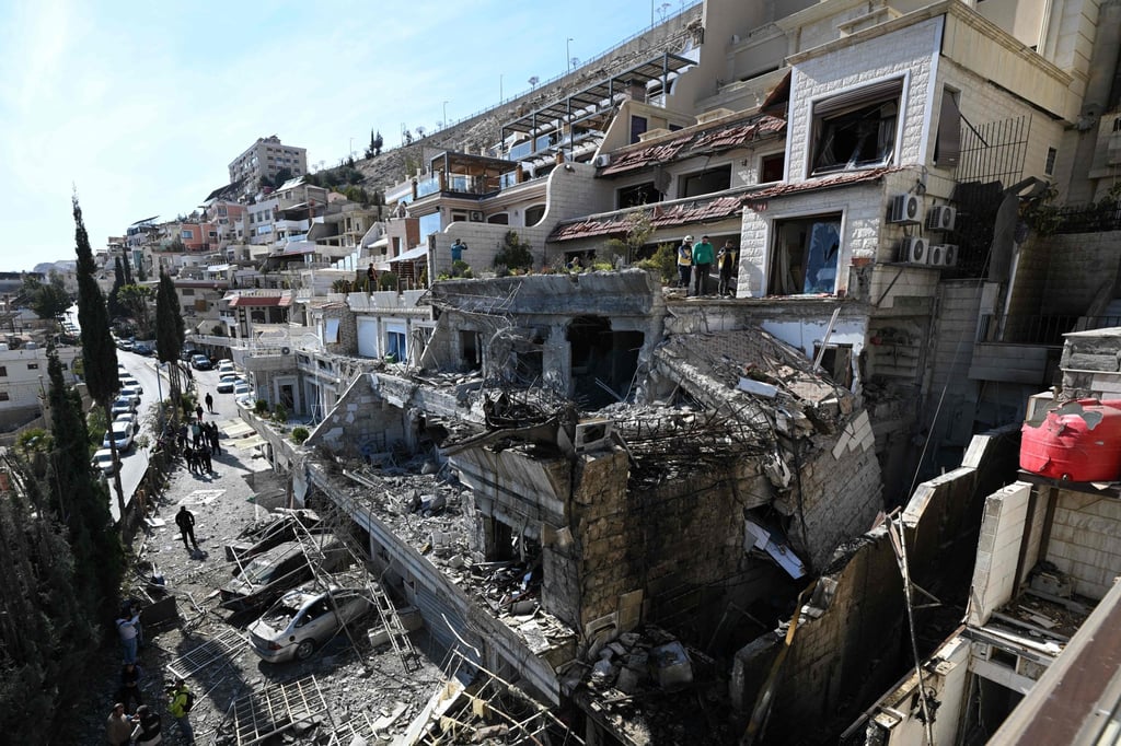 The aftermath of an Israeli air strike on a building in Damascus on March 13. File photo: AFP