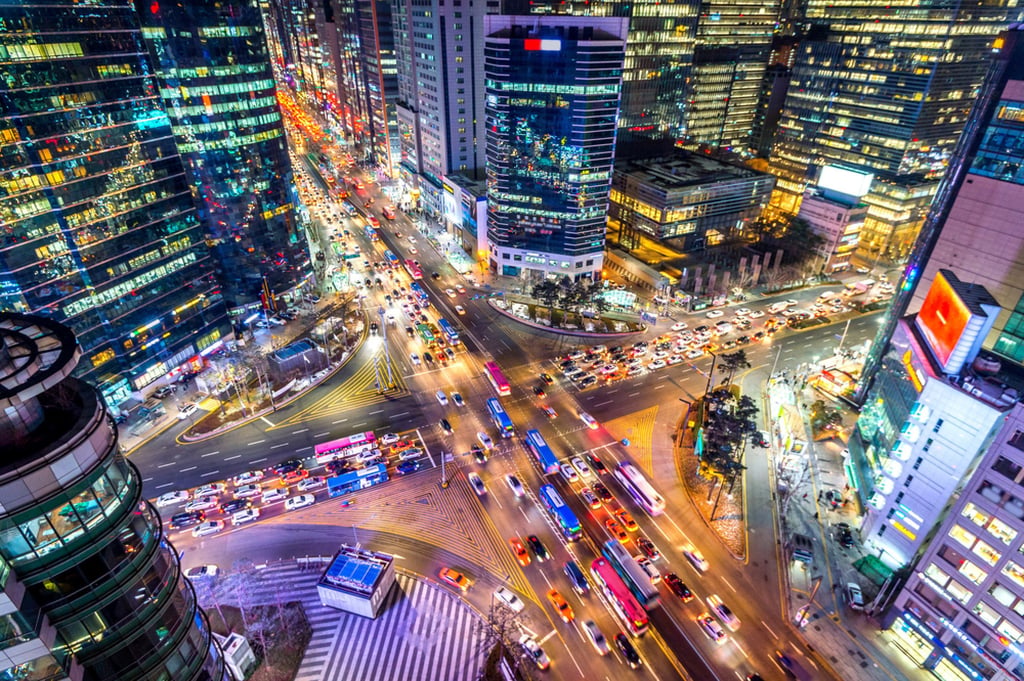Traffic speeds through an intersection at night in Seoul’s Gangnam district. Photo: Shutterstock