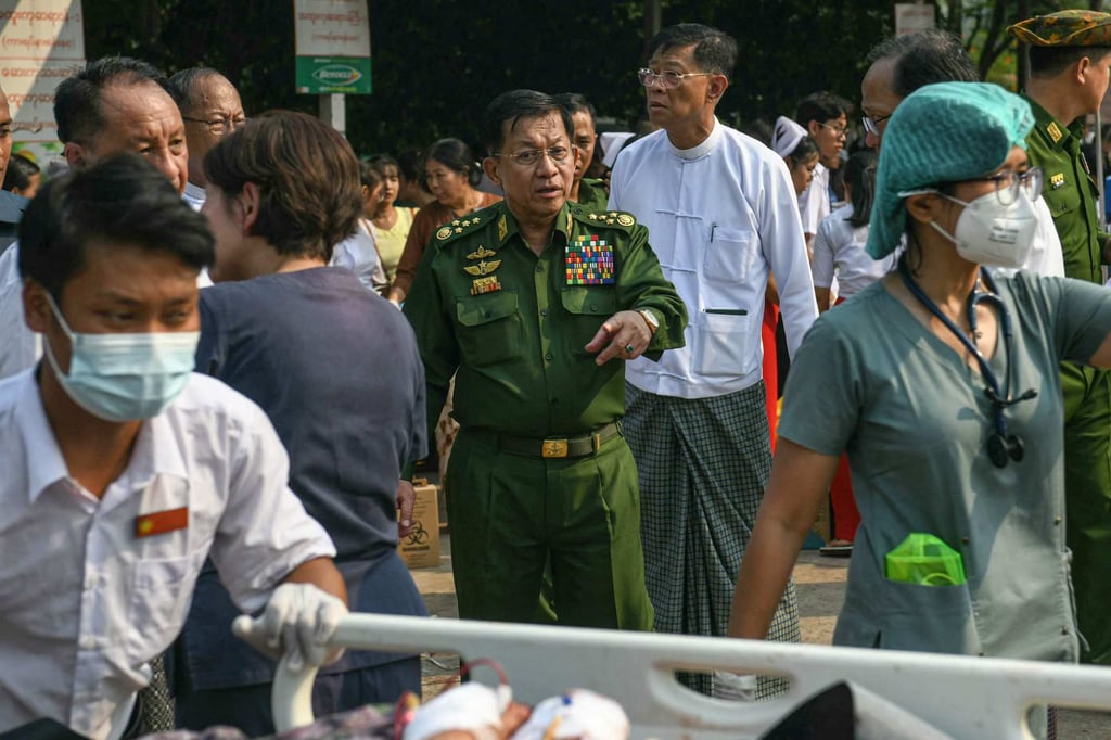 Junta chief Min Aung Hlaing (centre) visits a hospital in Naypyidaw on March 28 following the earthquake. Photo: AFP
