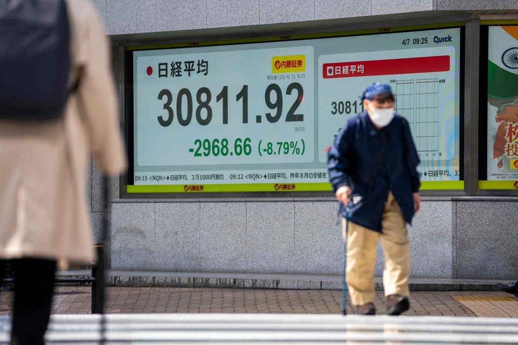 An electronic board showing the Nikkei 225 index on the Tokyo Stock Exchange on April 7, 2025. Photo: AFP