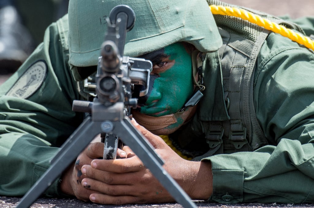 A member of the Venezuelan army takes part in a military parade in 2015. The military has said it is in a “state of alert” after the government warned of the suspected plot. Photo: AFP
