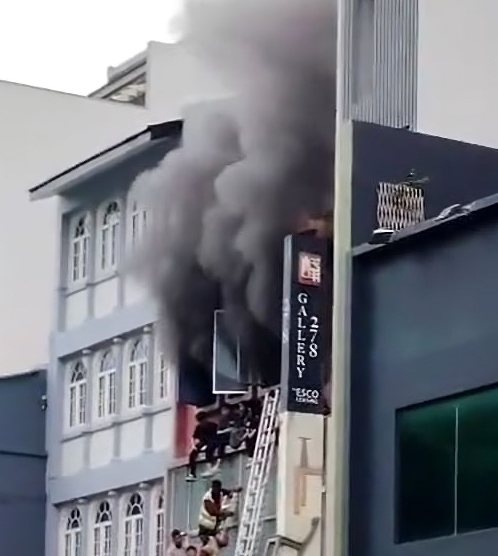 A still from a social media video shows smoke billowing from the shophouse in Singapore’s River Valley on Tuesday. Photo: TikTok/elvin.lee68