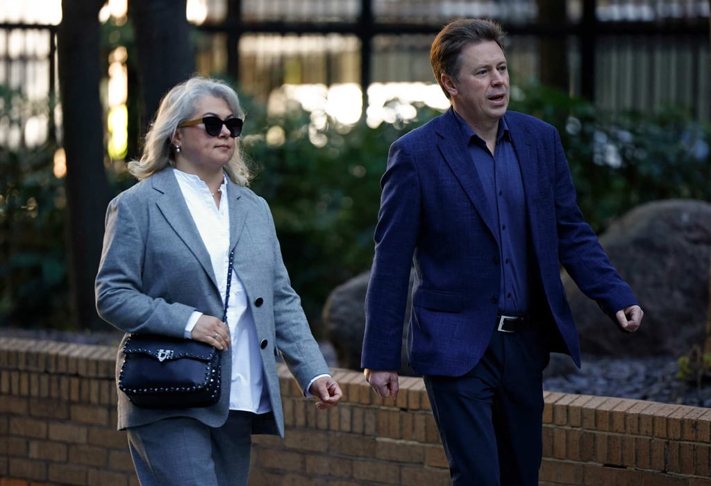 Former Russia government minister and former Mayor of Sevastopol, Dmitrii Ovsiannikov, and his wife Ekaterina Ovsiannikova arrive at court in London on Monday. Photo: AFP