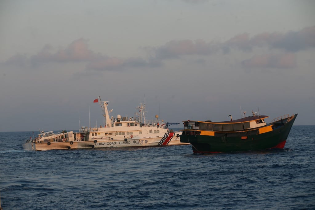 Chinese coastguard vessels execute a dangerous manoeuvre against the Philippines’ civilian supply boat Unaizah May 4 on March 23, 2024 during a regular resupply mission at the Second Thomas Shoal. Photo: Jeoffrey Maitem