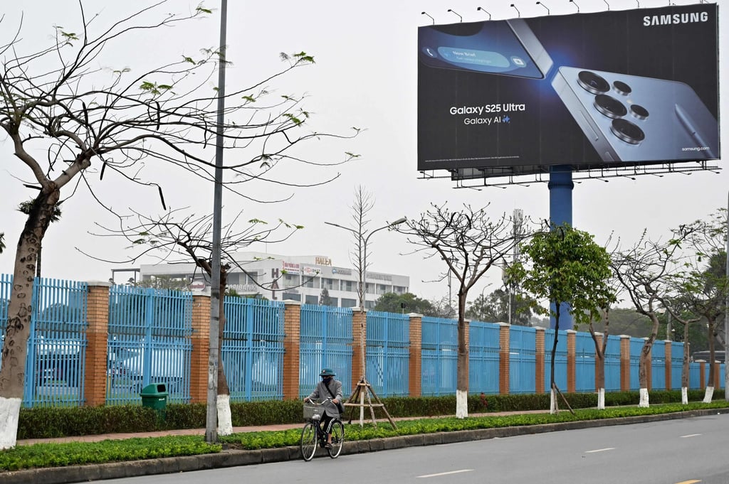 A man cycling outside a Samsung factory in Bac Ninh province. About 60 per cent of the 220 million phones Samsung sells each year globally are made in Vietnam. Photo: AFP