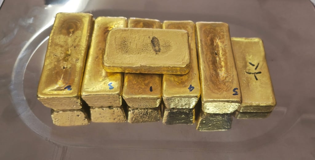 Seven pieces of what is suspected to be gold valued at US$500,000 are seized at the Indian national’s arrest. Photo: Facebook/Drug Enforcement Commission