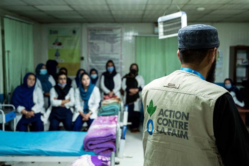 Dr. Farid Ahmad Barakzai (right) addressing Afghan medical staff in an inoperative Therapeutic Feeding Unit (TFU) in Kabul, Afghanistan on Monday. Entirely funded by Washington, the project had to shut down when the United States froze all aid. Photo: AFP
