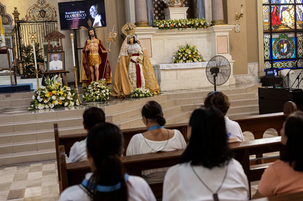 Filipinos pray after the death of Pope Francis was announced by the Vatican, at the Cubao Cathedral in Quezon City, the Philippines, on Monday. Photo: Reuters