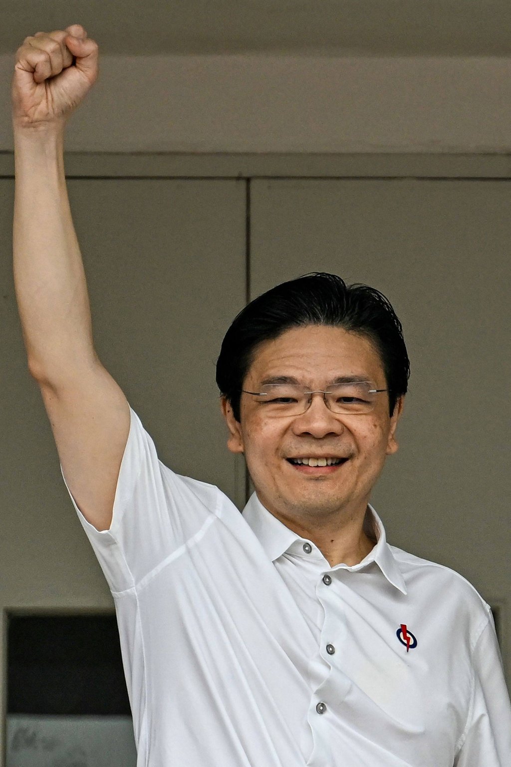 Singapore’s Prime Minister Lawrence Wong, also secretary general of the ruling People’s Action Party, greets supporters following his nomination on Wednesday. Photo: AFP