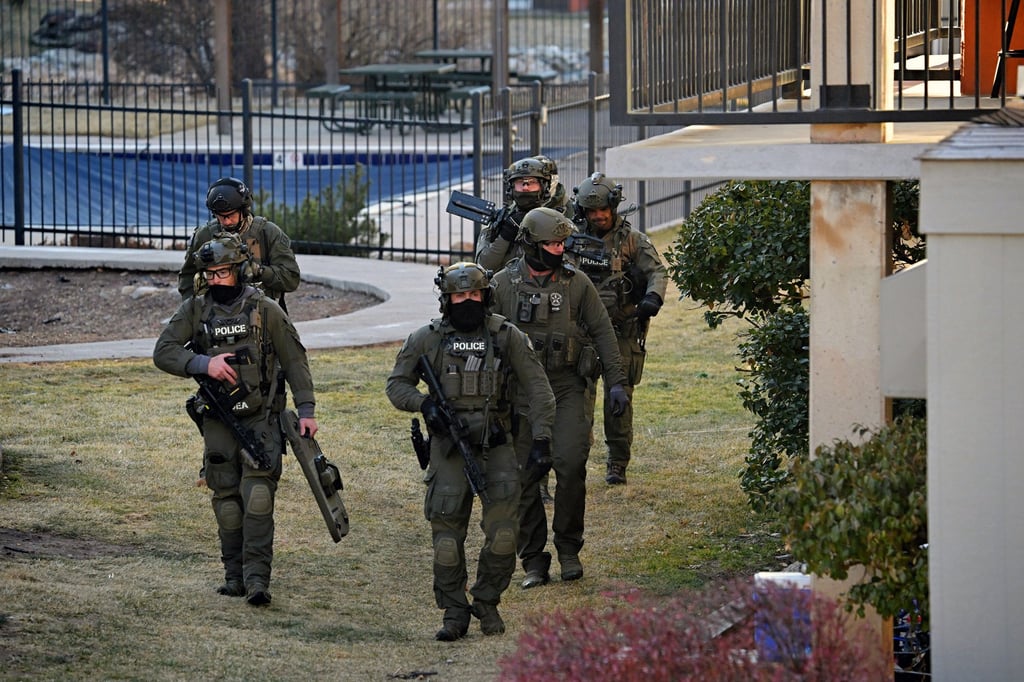 Federal law enforcement officers conduct an immigration raid in the US in February. Photo: The Denver Post/TNS