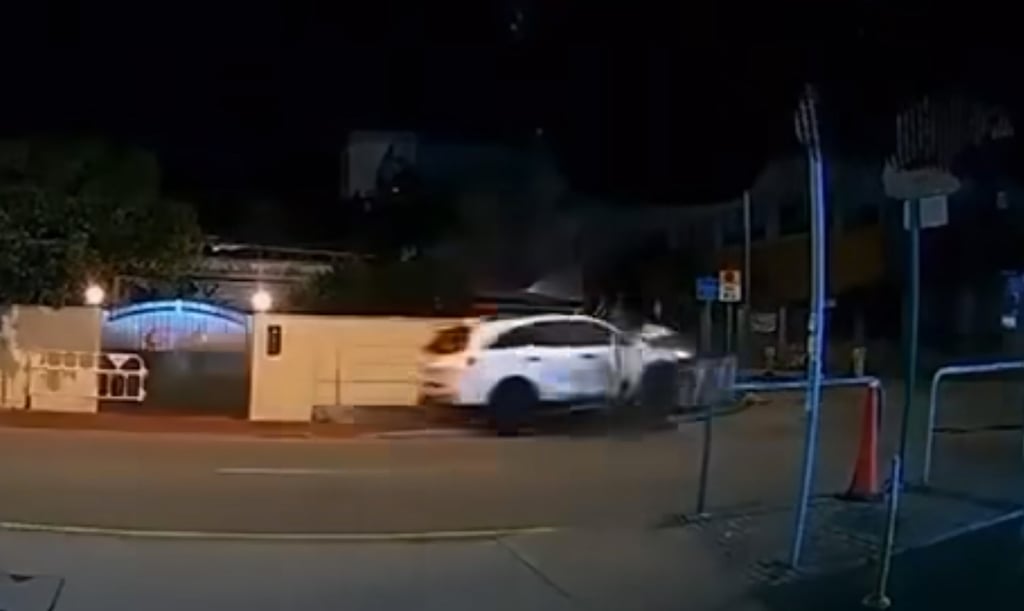 A screengrab from a video showing the car mounting the pavement. Photo: SCMP