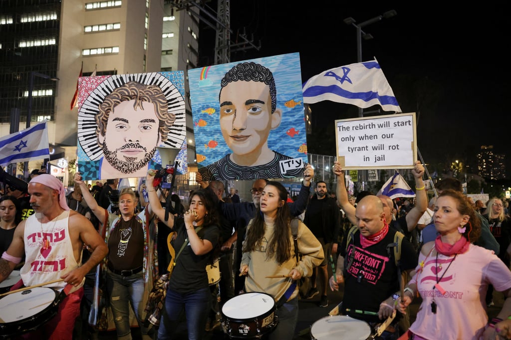 Supporters of Israeli hostages play drums during a protest in Tel Aviv on Saturday. Photo: Reuters
