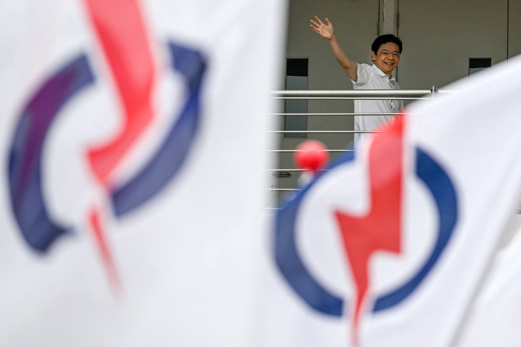 Singapore’s Prime Minister Lawrence Wong waves to supporters on Wednesday following his nomination ahead of the general election. Photo: AFP