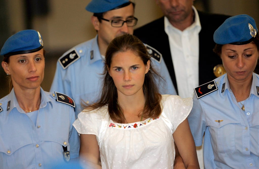 Amanda Knox escorted by Italian prison police officers after a hearing in 2008. Photo: AP