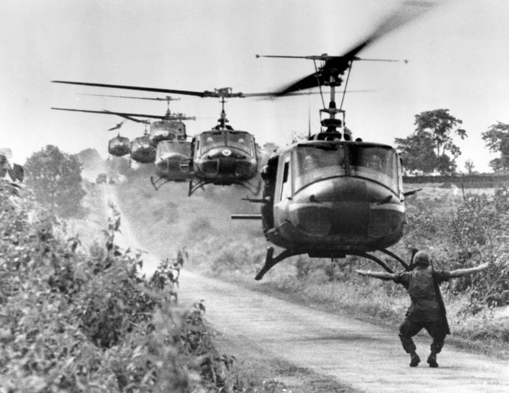 Huey helicopters carrying troops in 1965. File photo: AP