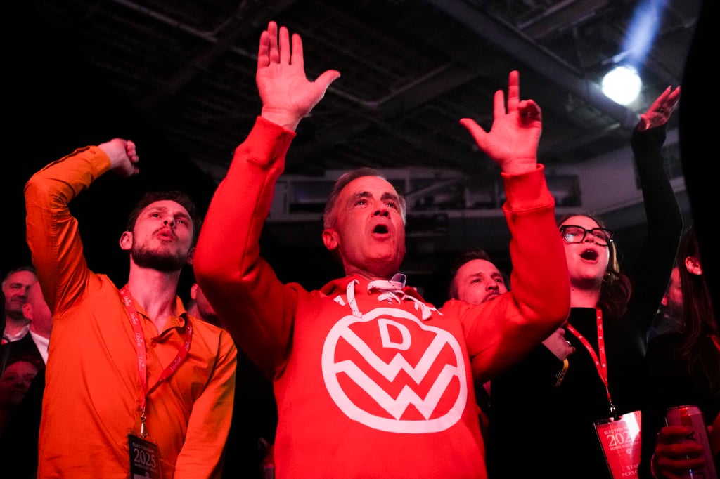 Canadian Prime Minister Mark Carney dances to Canadian band Down With Webster on Tuesday as they play live at campaign headquarters in Ottawa. Photo: Canadian Press via AP