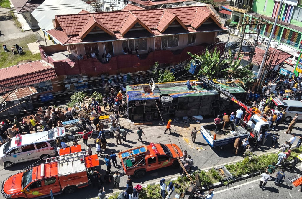 Rescuers working on an overturned bus after a crash in Indonesia on Tuesday. Photo: Indonesia’s Search and Rescue Agency/ EPA-EFE