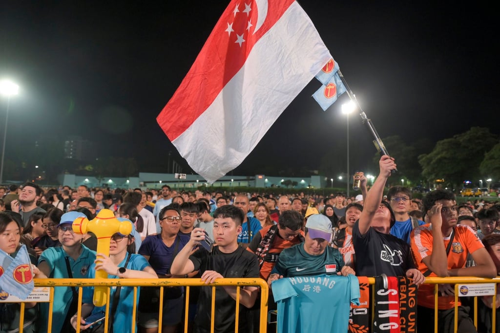 Supporters of the opposition Workers’ Party listening to a speech on Saturday night as preliminary results trickled in. Photo: EPA-EFE