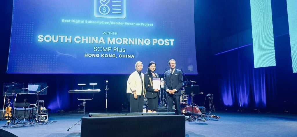 Catherine So (centre), CEO of the South China Morning Post, receiving the trophy in Krakow, Poland. Photo: Wan-IFRA