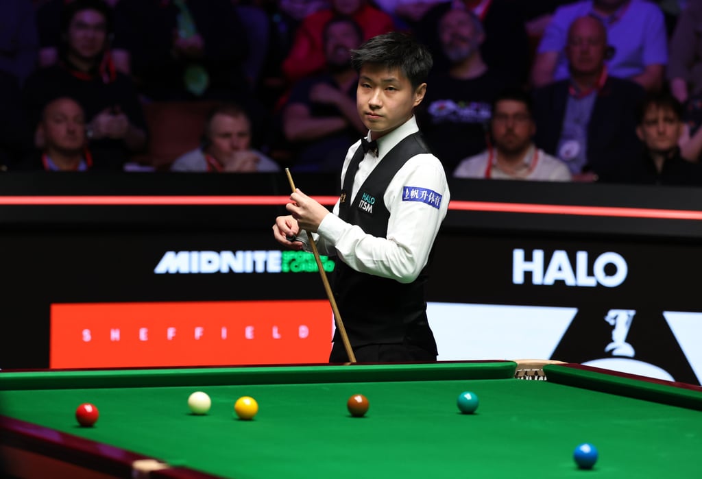 Zhao Xintong at the table during his accomplished display in the world final. Photo: Xinhua