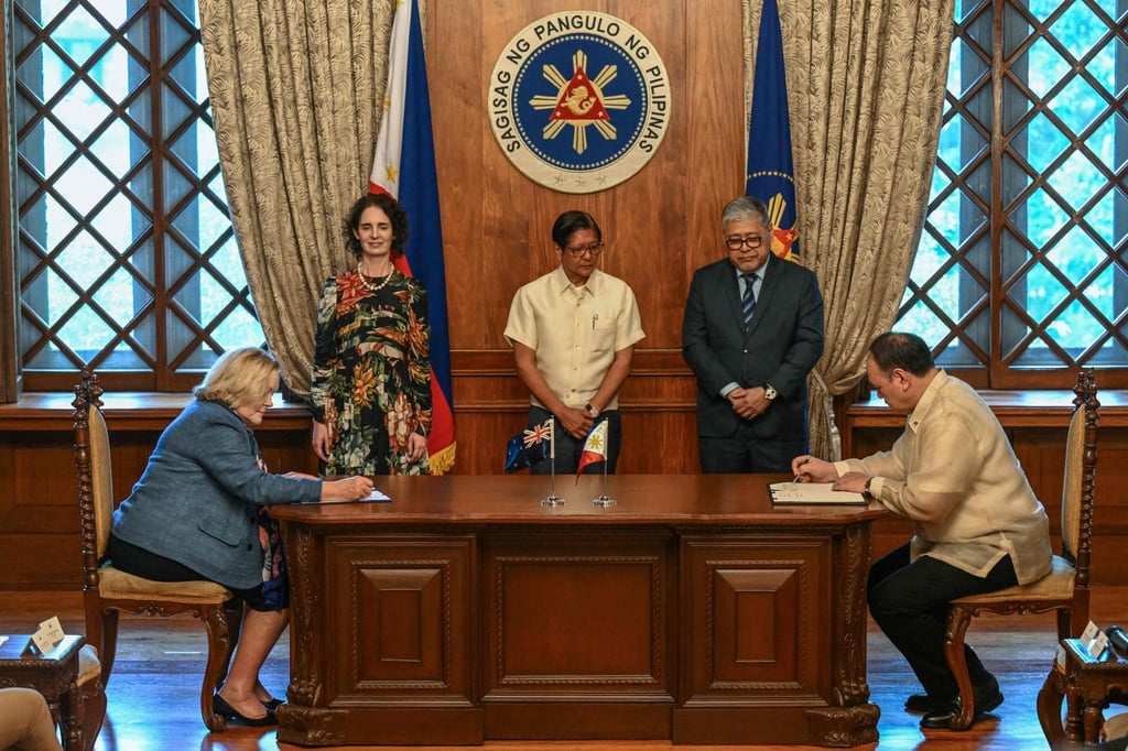 Philippine President Ferdinand Marcos Jnr (centre) looks on during the signing of the Status of Visiting Forces Agreement in Manila on April 30. Photo: AFP