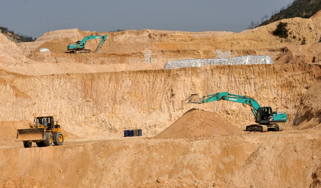 Heavy machinery works a rare earth mine in central China’s Jiangxi province. Photo: AP
