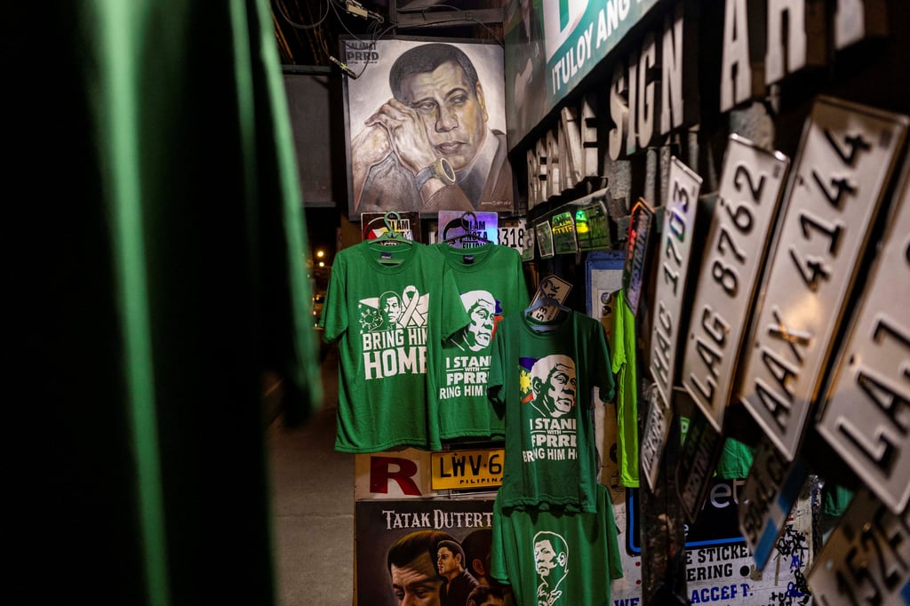 T-shirts with illustrations of former president Duterte are displayed for sale at a shop in Davao City. Photo: Reuters