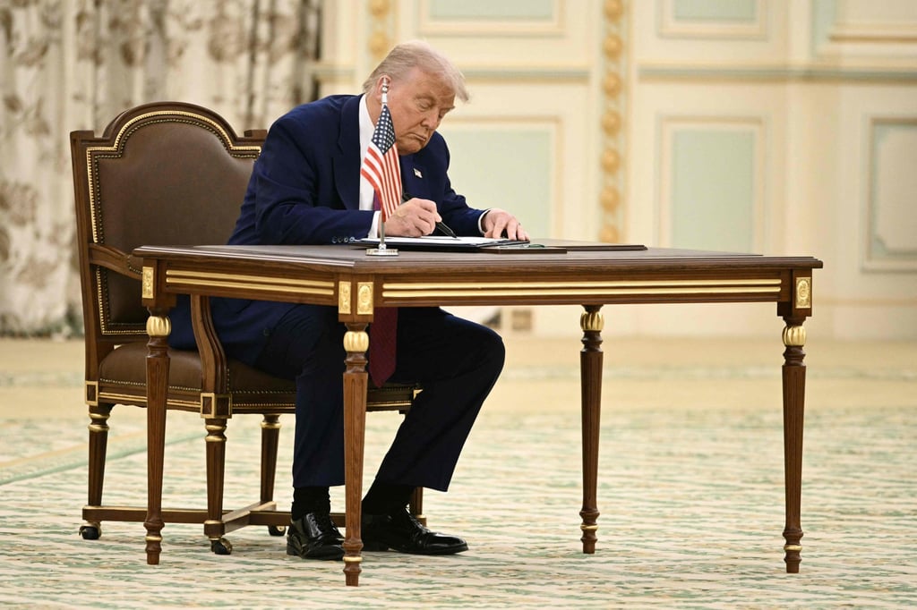 US President Donald Trump signs a document during a bilateral meeting with Saudi Crown Prince Mohammed bin Salman, in Riyadh on Tuesday. Photo: AFP