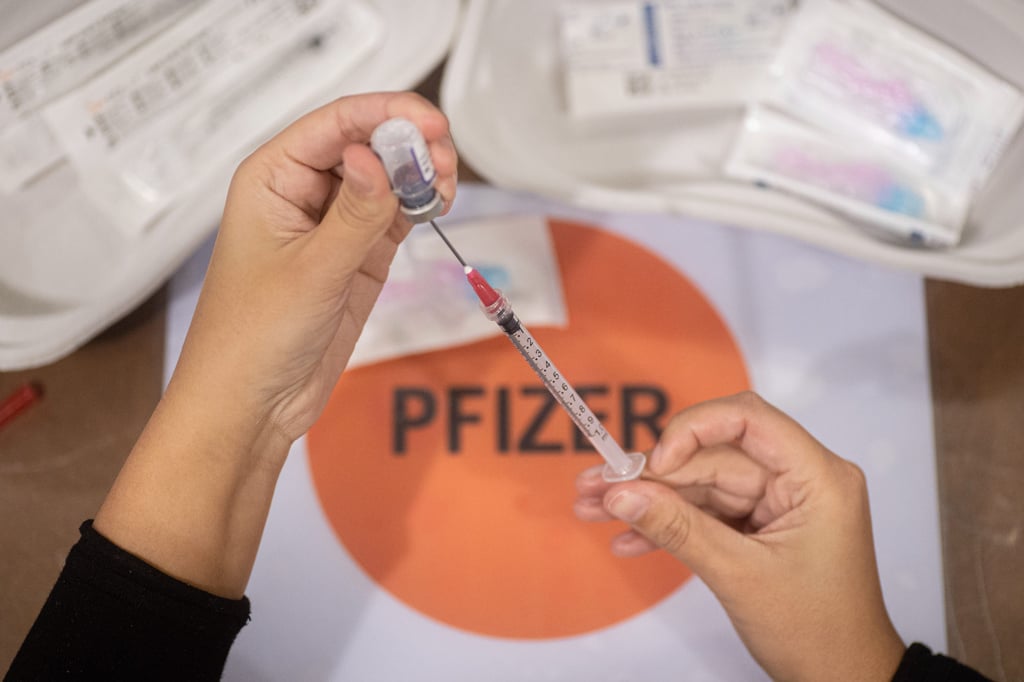 A healthcare worker prepares the Pfizer-BioNTech Covid-19 vaccine in Eindhoven in 2022. Photo: via Getty Images