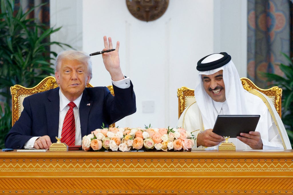US President Donald Trump and Qatar’s Emir Tamim bin Hamad Al Thani take part in a signing ceremony in Doha on Wednesday. Photo: Reuters