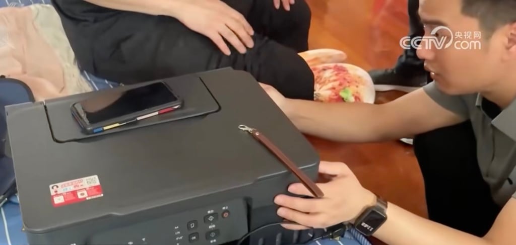 The police seized a printer, paper cutters, and ink when they raided the couple’s home. Photo: CCTV