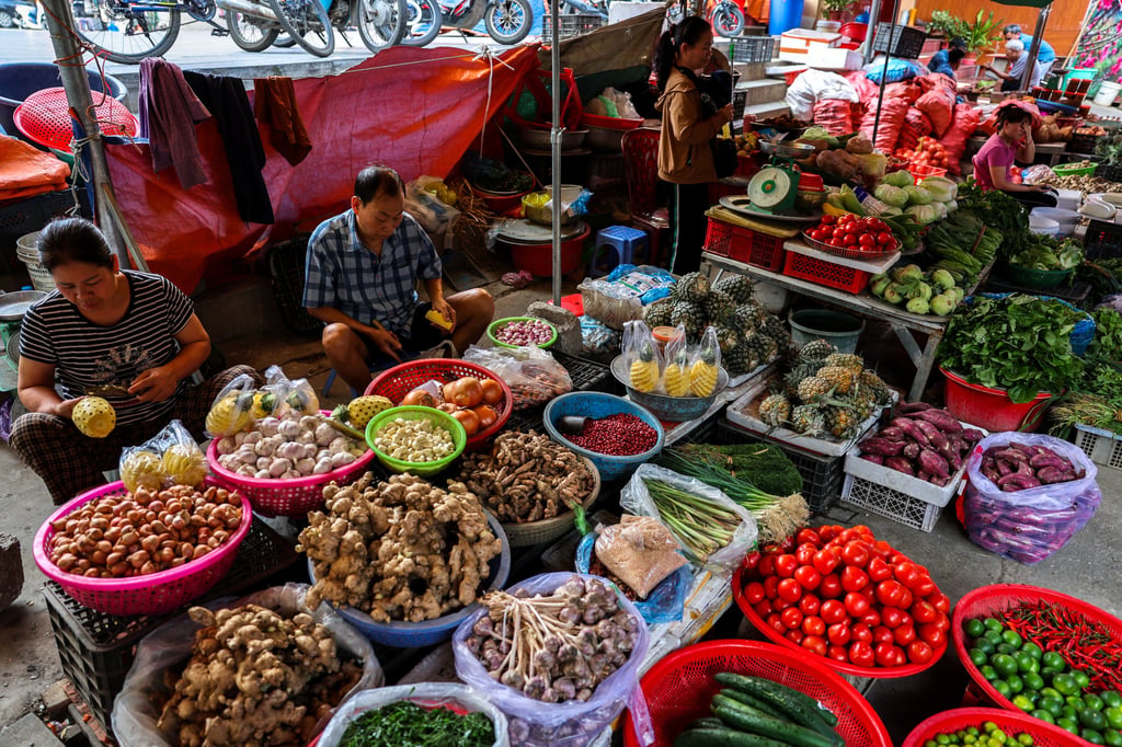 Vendors seen at their fruit stalls inside a market in Dong Dang township, Vietnam, in April after Trump had announced a 46 per cent tariff on the country. Photo: Reuters