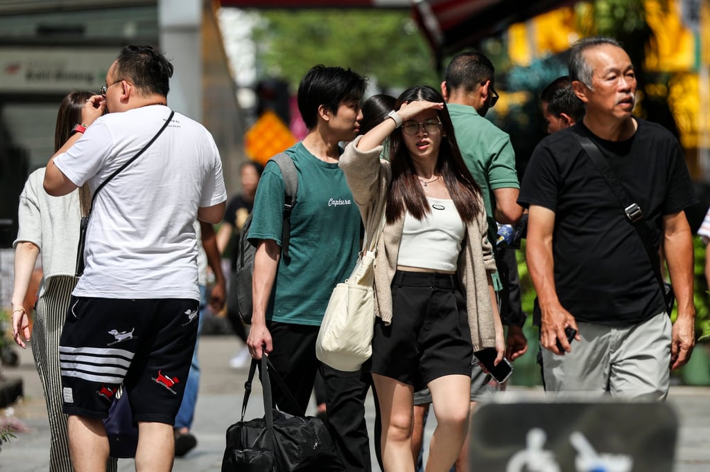 People walk along a street in Kuala Lumpur, Malaysia. Photo: EPA-EFE