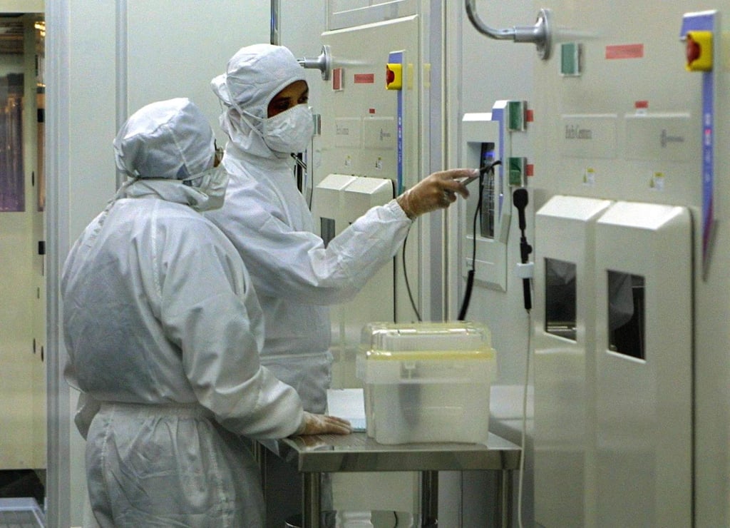 Technicians work at a semiconductor factory near Kuala Lumpur in 2002. Photo: AFP