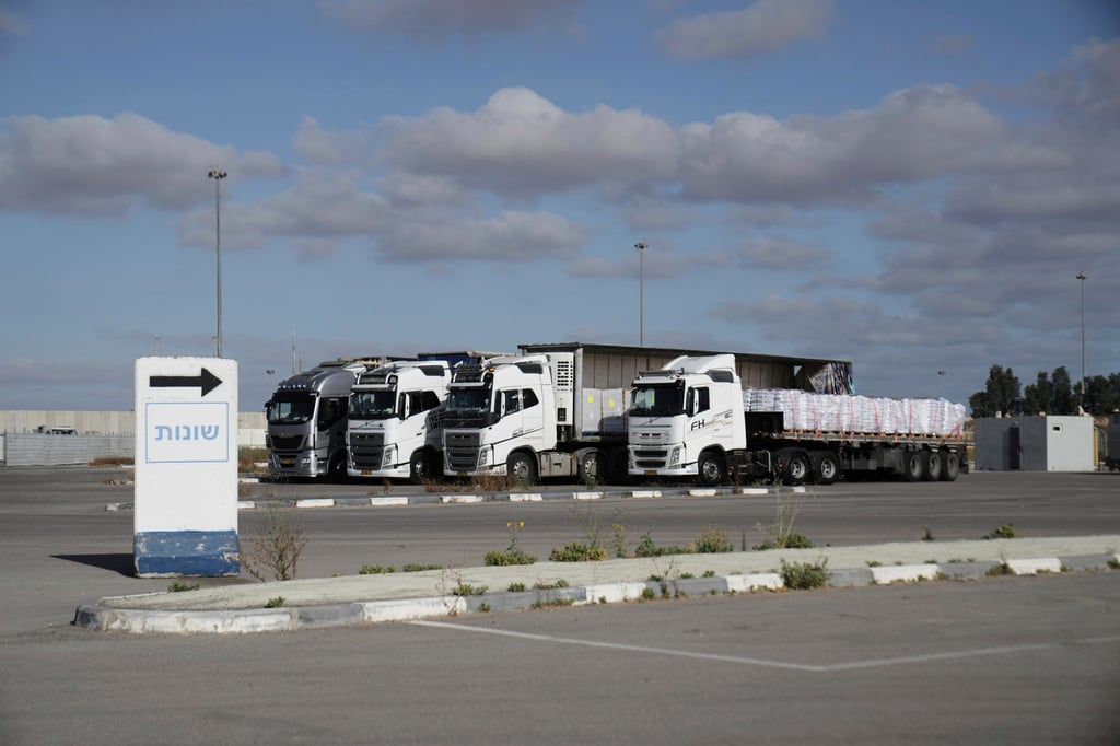 Trucks load with humanitarian aid for the Gaza Strip at the Kerem Shalom Crossing in southern Israel, on Tuesday. Photo: AP