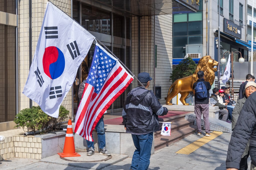 Far-right protesters hold up Korean and American flags, while chanting anti-China messages, during a demonstration in April following Yoon Suk-yeol’s impeachment. Photo: Kim Jung-yeop