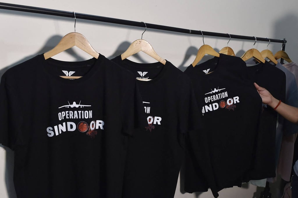T-shirts featuring “Operation Sindoor” on display at a store in Ludhiana, India. Businesses have cashed in on the recent flare-up in the India-Pakistan conflict, offering military operation-themed T-shirts and tote bags. Photo: AFP