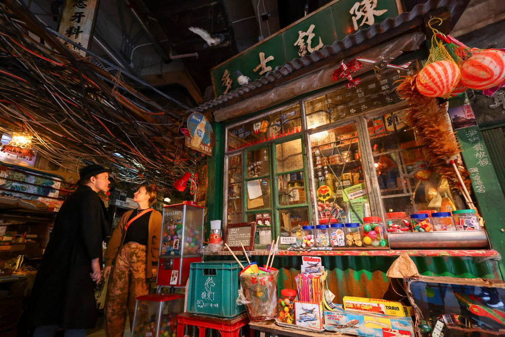 Visitors take a walk back in time to the old days of Kowloon Walled City as part of the Twilight of the Warriors: Walled In exhibition. Photo: Dickson Lee