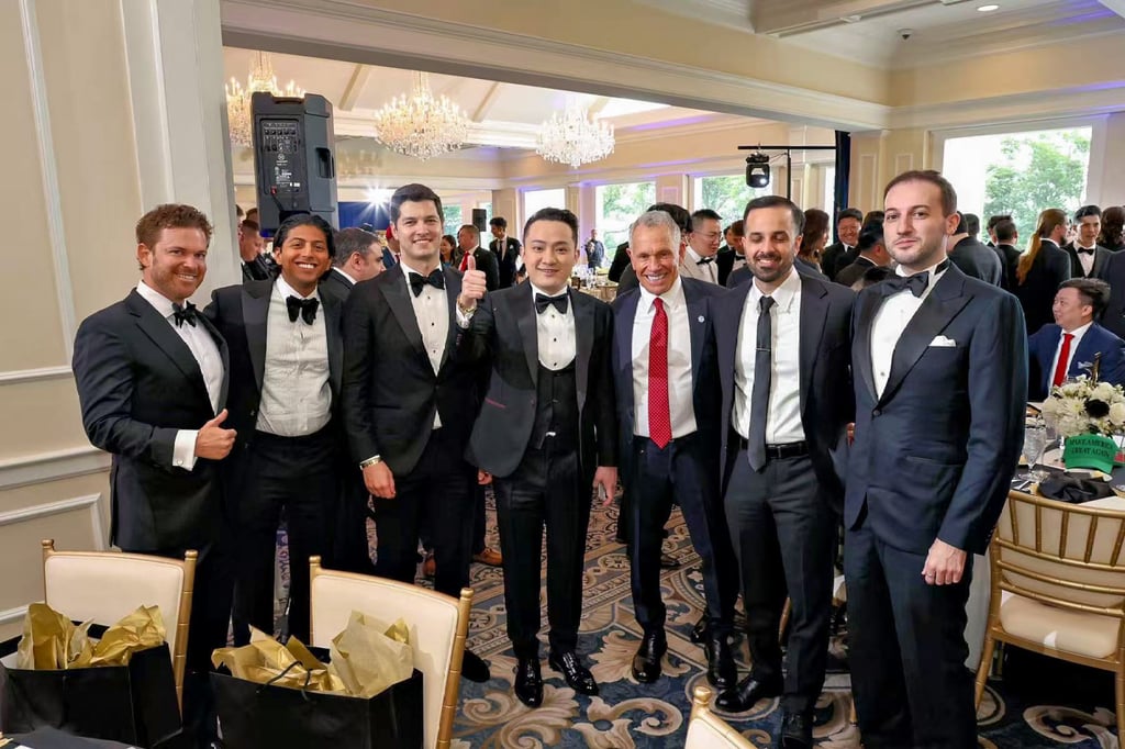 Justin Sun (centre) poses with other attendees at Trump’s dinner for top holders of his cryptocurrency. Photo: Justin Sun