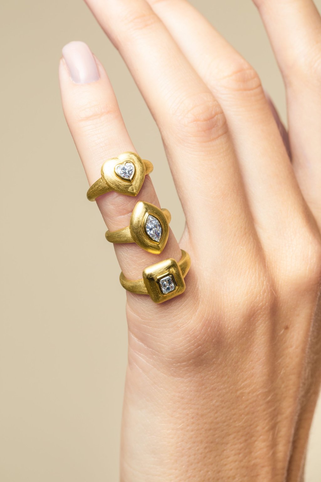 A stack of Maison H Jewels’ 18k yellow gold and diamond rings. Photo: Handout