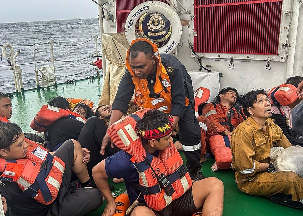 Crew members of the Liberian-flagged container ship are seen after being rescued off the Kerala coast on Sunday. Photo: Indian Defence Public Relations Office of Mumbai / AFP