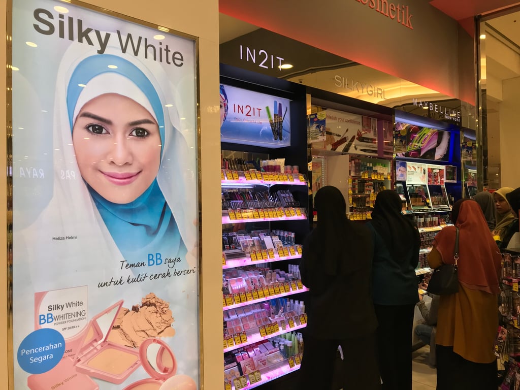 Muslim women looking at Islamic beauty products in Malaysia. The demand for halal cosmetics have risen in the country. Photo: Shutterstock