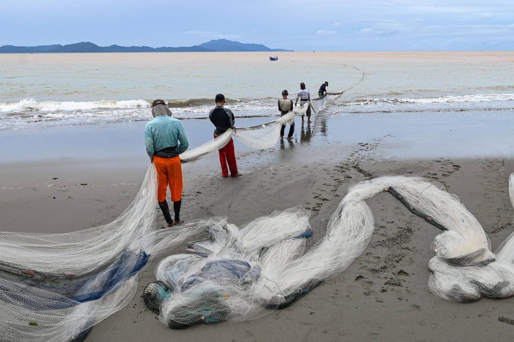 Fishermen pull a net onto a beach in Banda Aceh, Indonesia. The blue economy is a key component of Asean’s push for sustainable development. Photo: AFP
