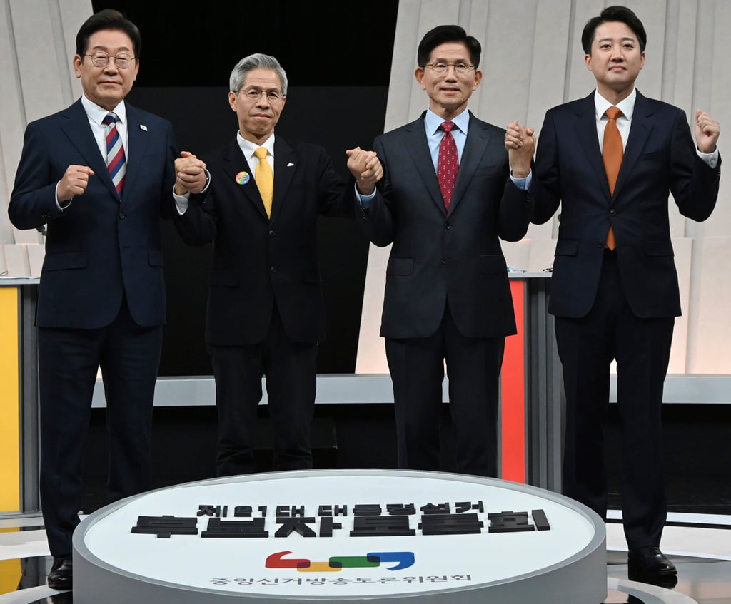 South Korea’s presidential candidates (from left) Lee Jae-myung, Kwon Young-guk, Kim Moon Soo and Lee Jun-seok ahead of the third televised presidential debate on Tuesday. Photo: Kyodo/AP