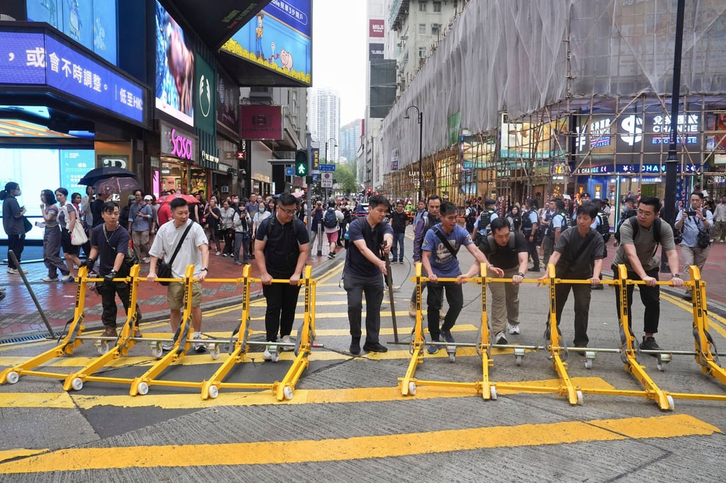 Police officers block off East Point Road in Causeway Bay. Photo: Elson Li