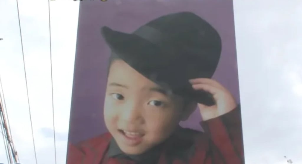 One of the huge adverts featuring an image of Yu-kun as a young boy. Photo: QQ.com