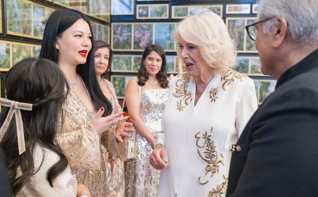 Li Xiang enjoys mixing with the rich and famous. Here she is chatting with Britain’s Queen Camilla. Photo: Weibo