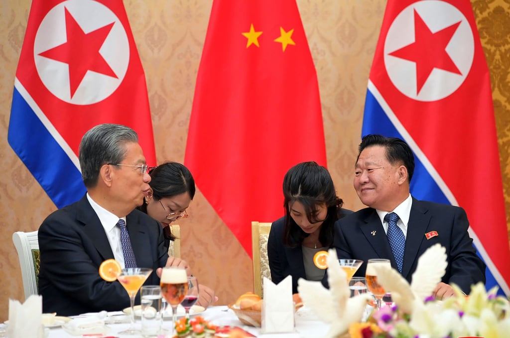 North Korean official Choe Ryong-hae (right) speaks with Zhao Leji (left), chairman of the National People’s Congress of China, during a reception in Pyongyang last year. Photo: KCNA/KNS via AP