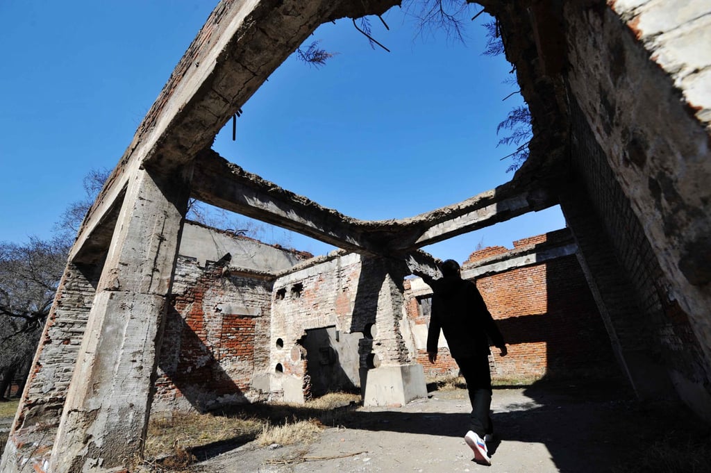 A visitor walks through the ruins of one of Japan’s germ warfare facilities during WWII in China’s northeastern city of Harbin in 2014. Photo: Xinhua