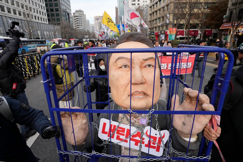 Protesters rallying against then-South Korean president Yoon Suk-yeol in Seoul last December following his failed martial law attempt. Photo: AP